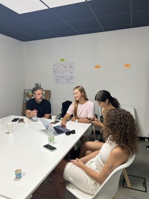 Students collaborating during an entrepreneurship mentoring session