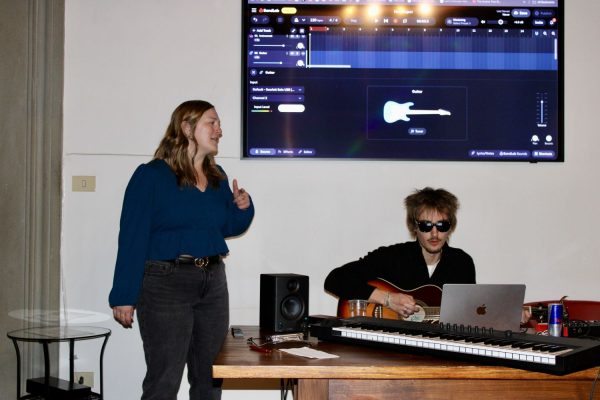 ESE Florence student speaking during a student-led music workshop with live guitar and digital audio software.